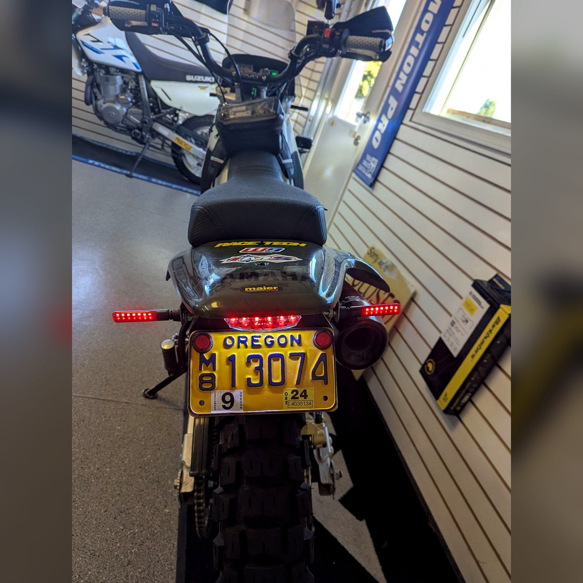 Flexi Fender tail tidy installed on a Yamaha TW200, rear view with LED tail light and signals